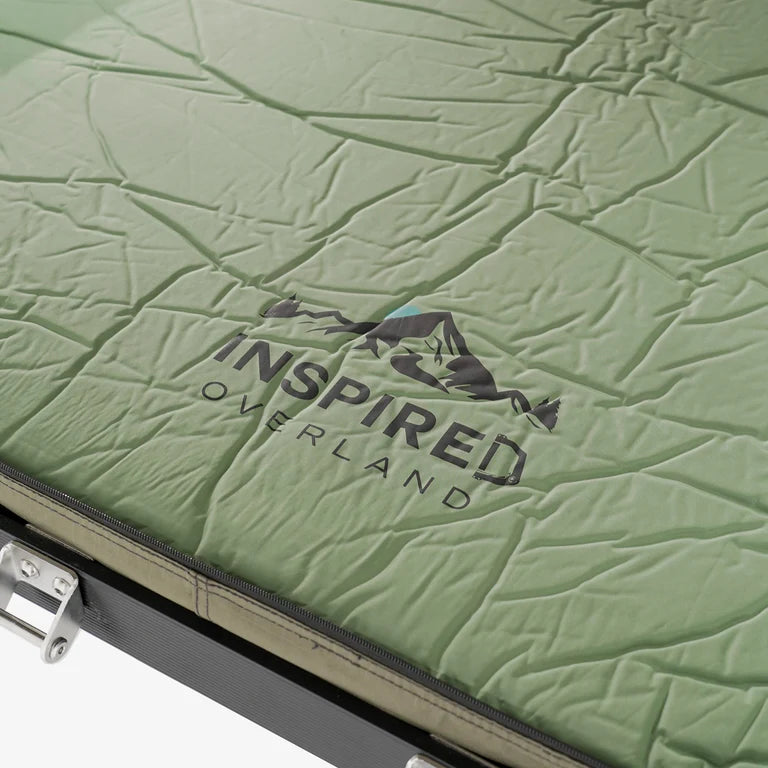 Inspired Overland rooftop tent cover strap close up, protective travel cover hardware for secure transport and weather resistance