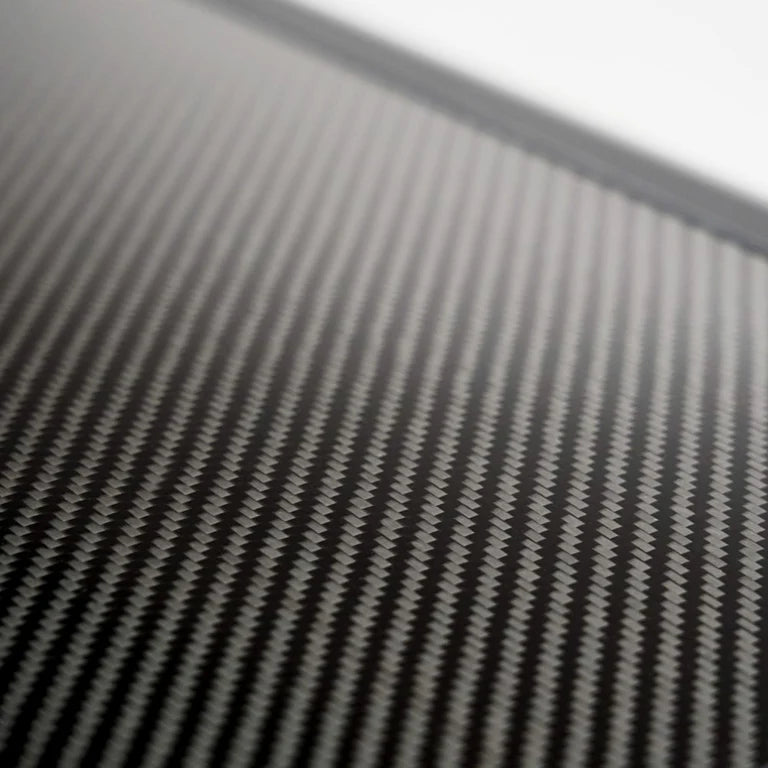 Inspired Overland Carbonlite logo badge on carbon fiber rooftop tent shell