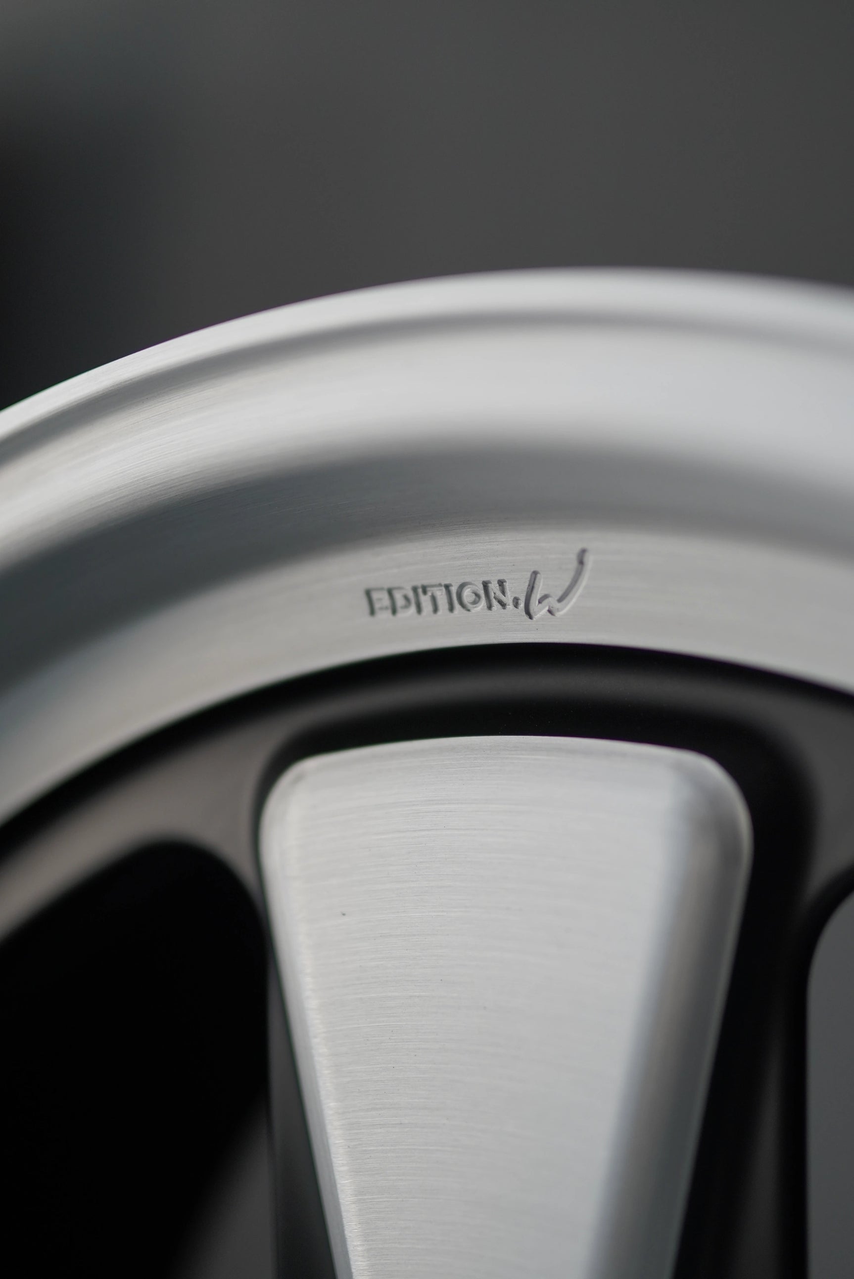 Close-up of brushed spoke detailing on Edition W forged Porsche 5x130 wheel.