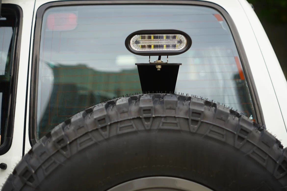 Toyota Land Cruiser 80 Series spare tire carrier light mount bracket – Heavy-duty steel bracket for chase light or reverse light installation.