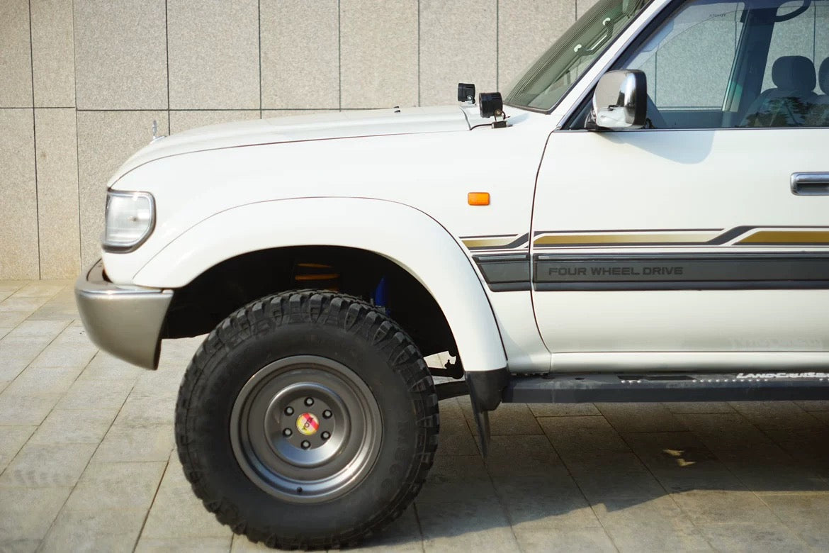 Toyota Land Cruiser 80 Series ditch light mounts – Heavy-duty brackets for auxiliary lights, bolt-on installation using OEM bonnet hardware.