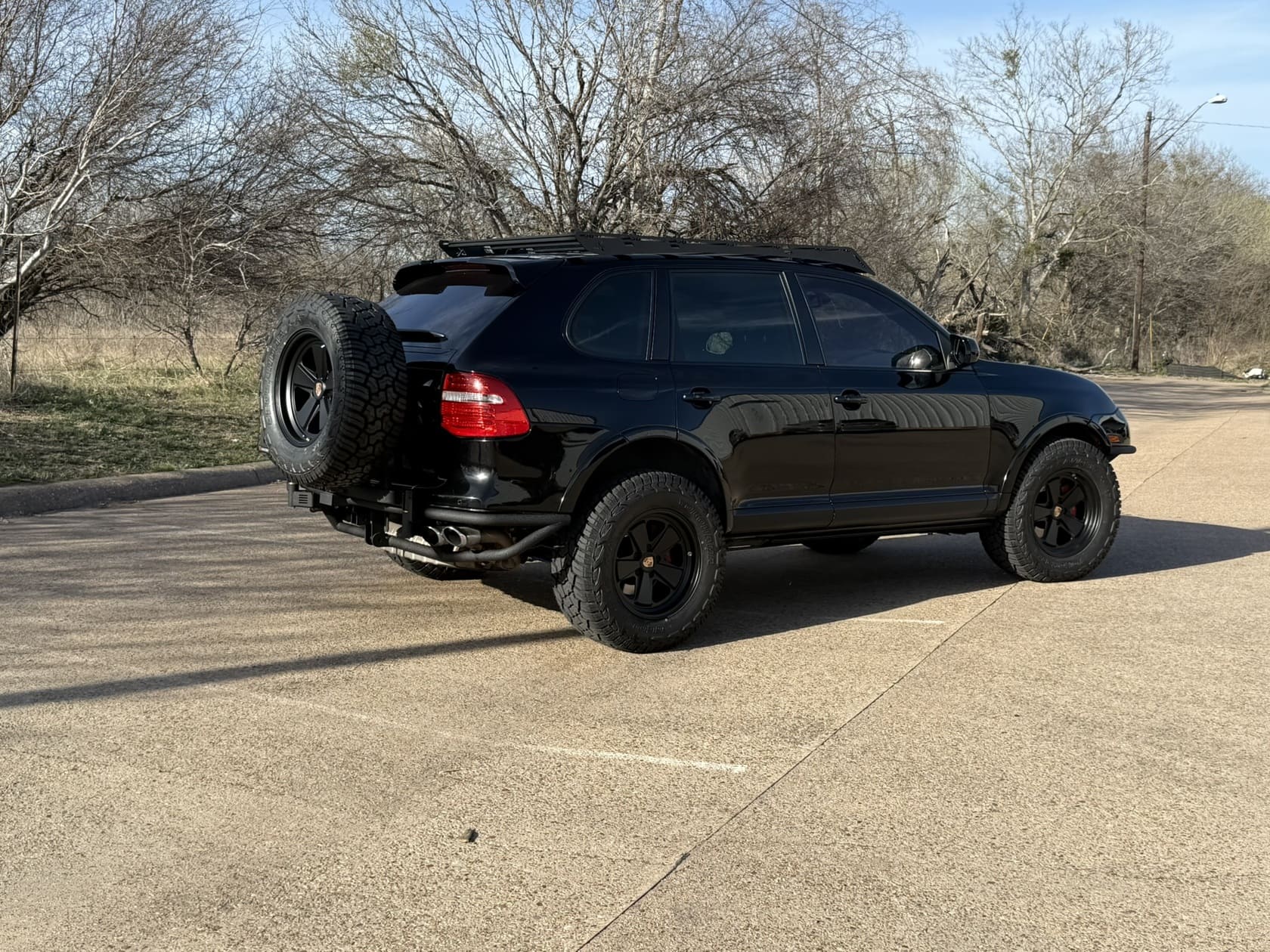 Blackout Porsche Cayenne 957 gts offroad Tubular bumper with swing out tire carrier.