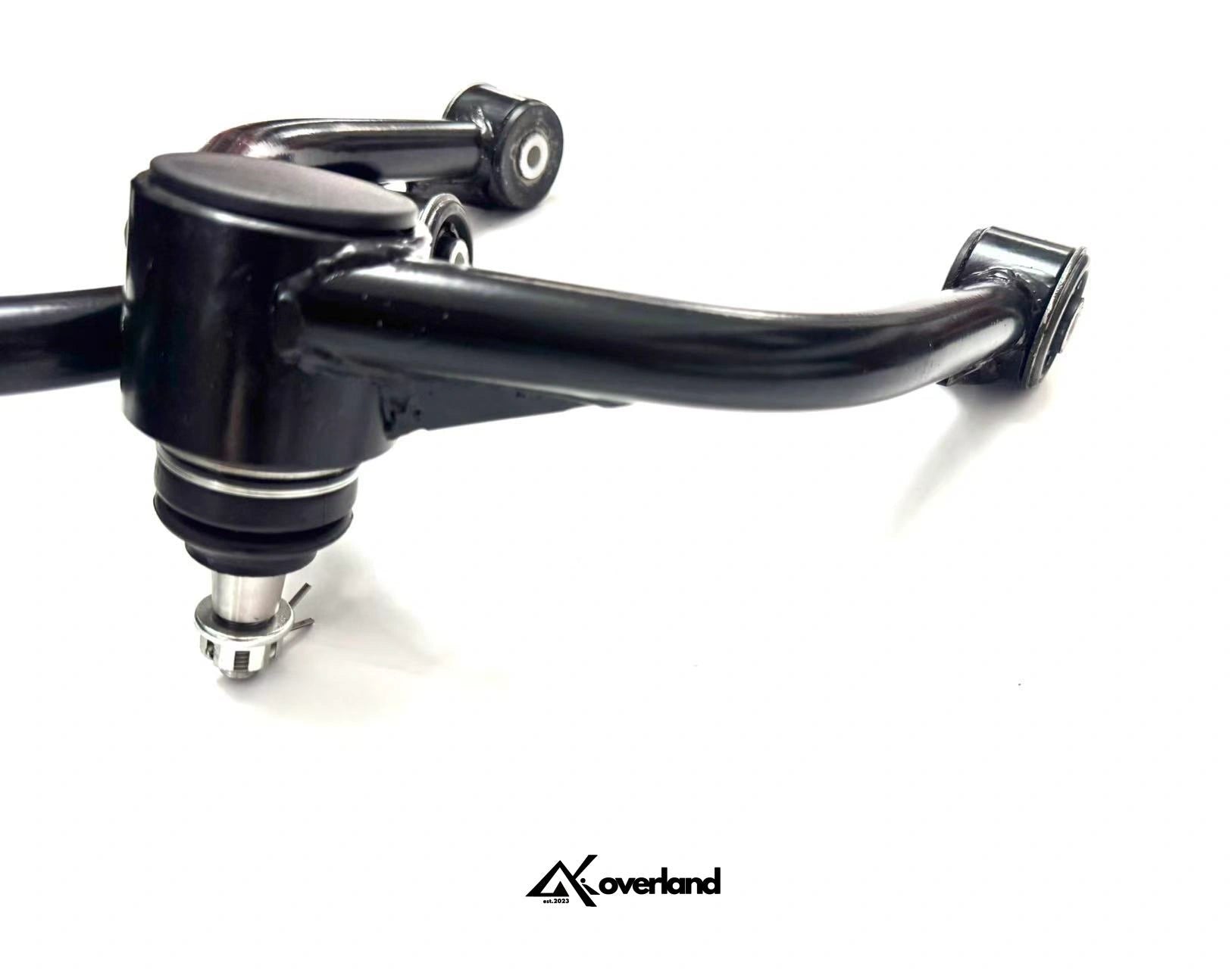 Triangulated tubular bracing structure on Akioverland control arm ensuring symmetry and durability under off-road articulation.