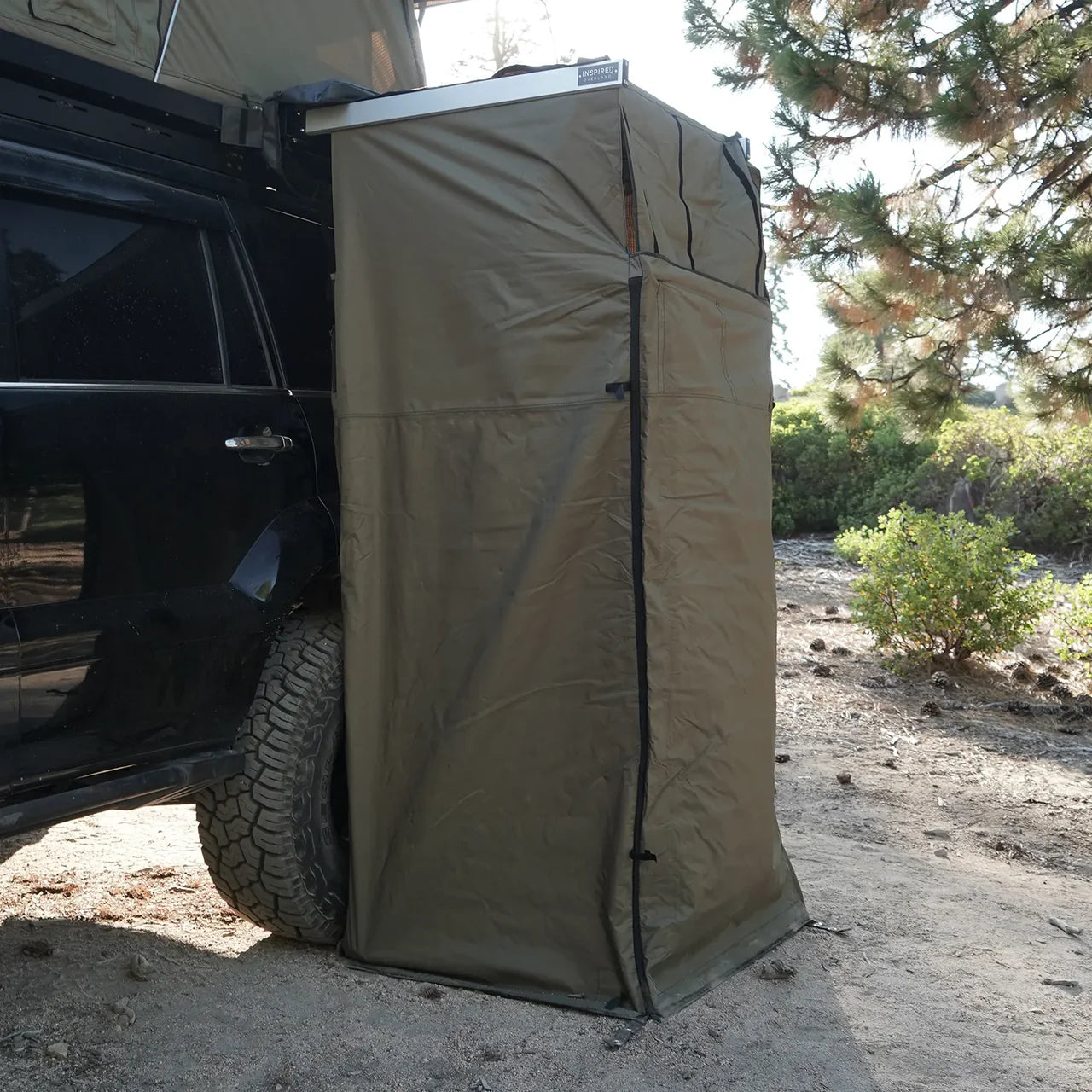 Inspired Overland shower awning mounted on vehicle overland camping privacy tent