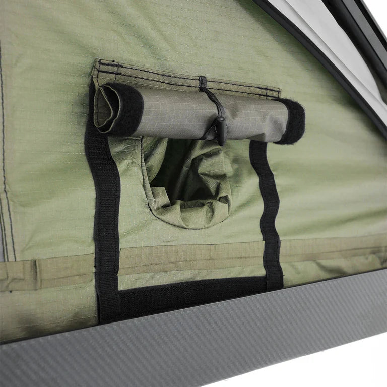 Inspired Overland rooftop tent cover strap close up, protective travel cover hardware for secure transport and weather resistance