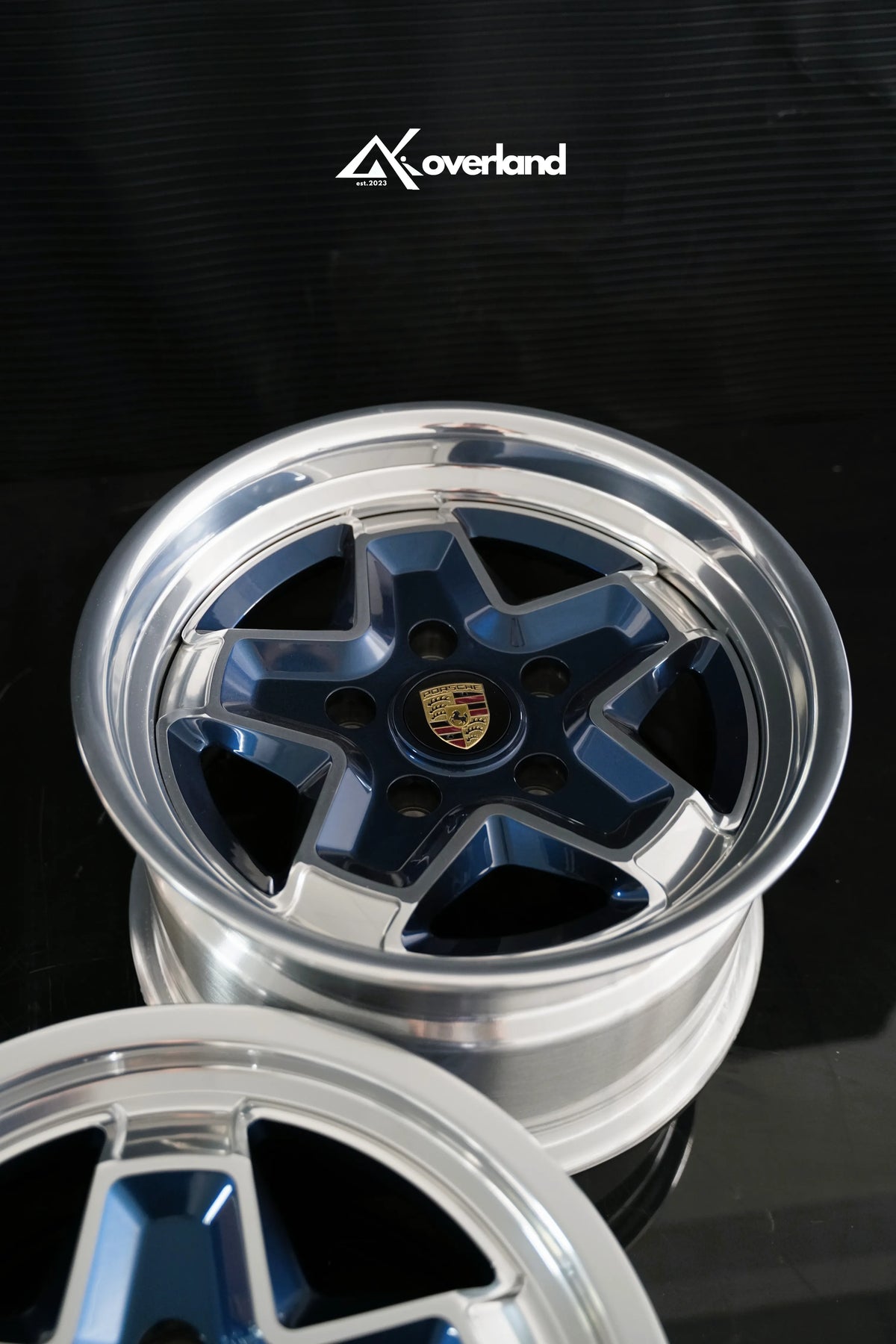 Hidden hardware 2-piece forged cookie cutter wheel in midnight blue for Porsche 911 street builds by AkiOverland