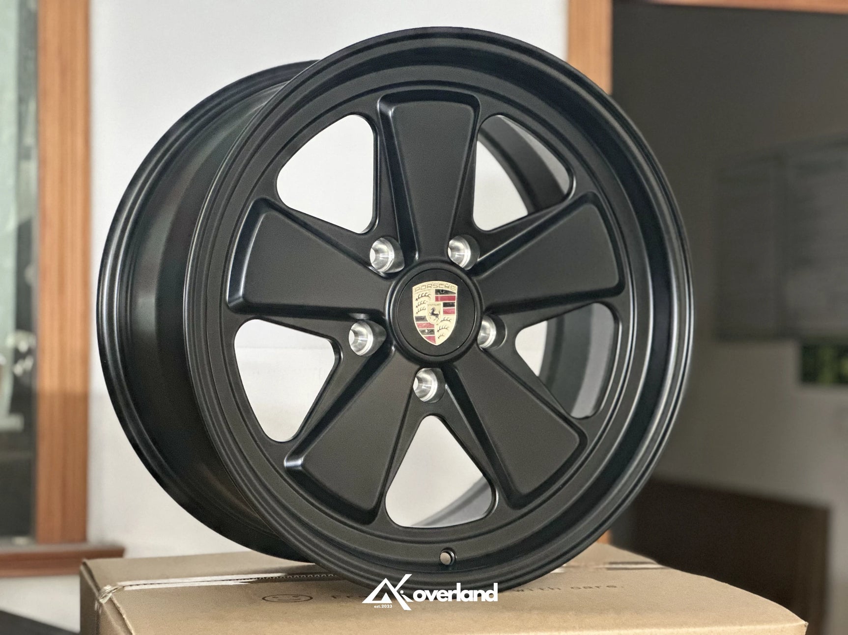 Satin black Akioverland 5x130 forged fuch wheel showing deep lip contour, engineered for Porsche Cayenne off-road use.