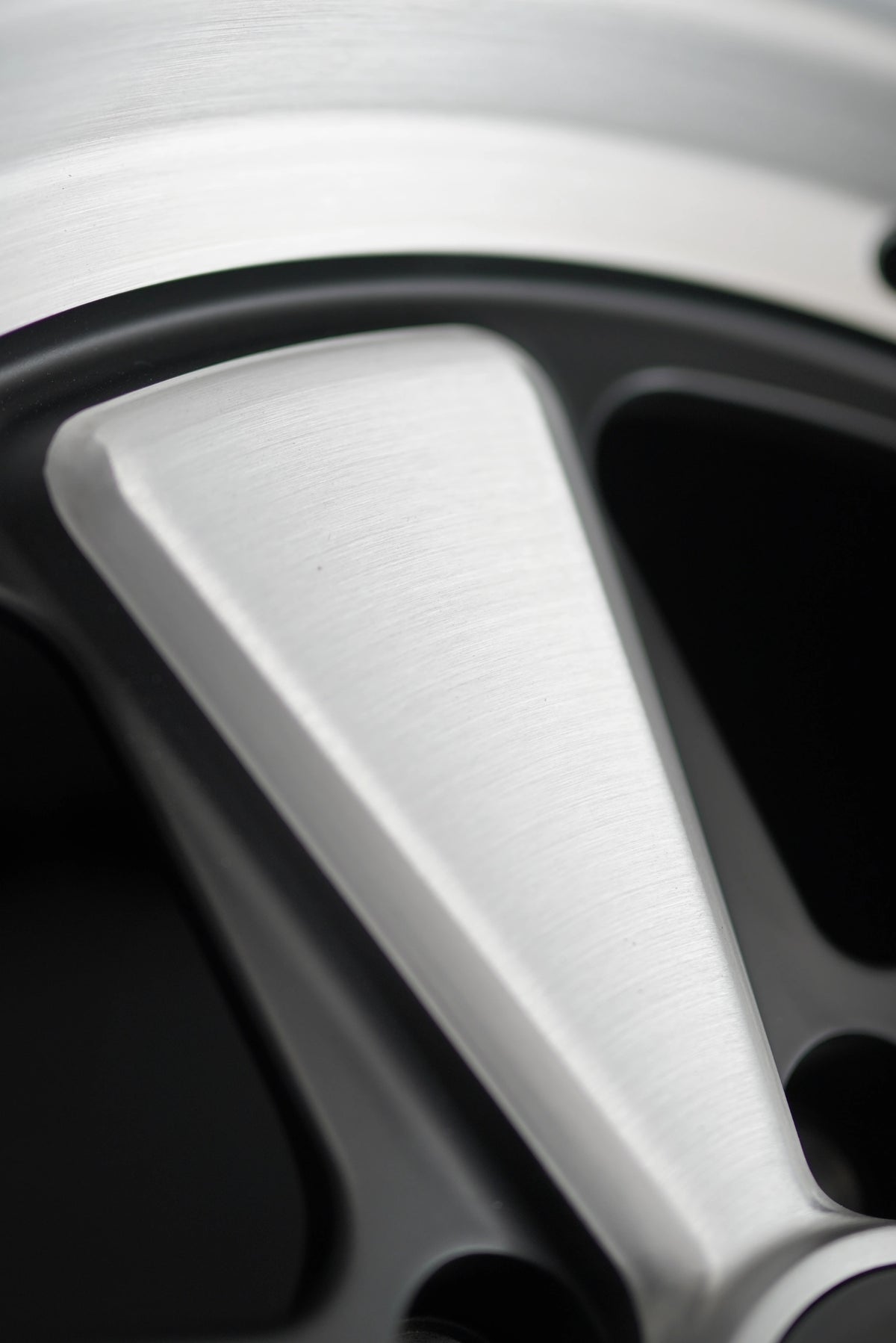 Three-quarter studio view of the AkiOverland Edition W forged wheel for Porsche 5x130 with classic five-spoke layout