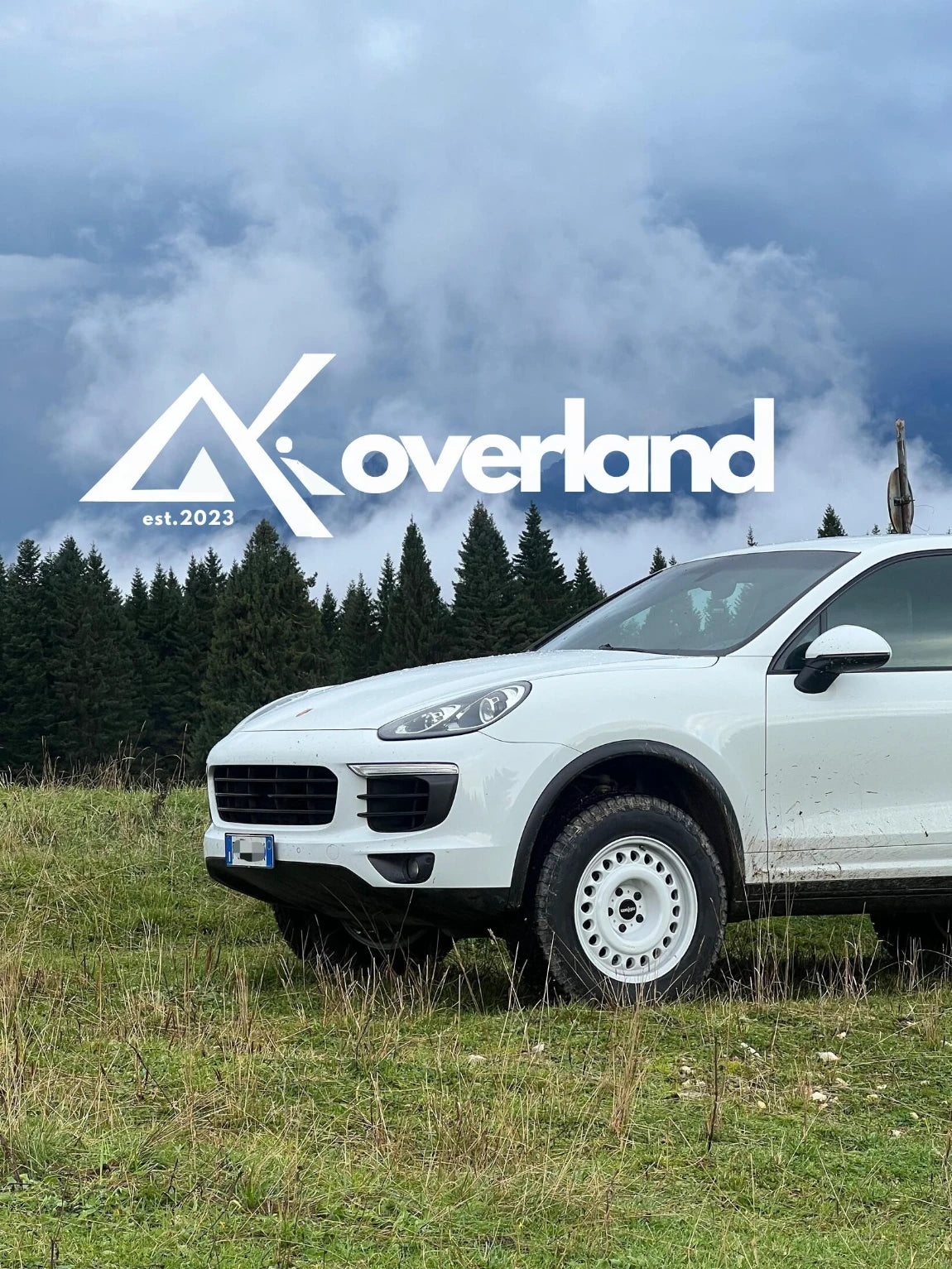Lifted Porsche Cayenne 958 off-road build with Akioverland spring suspension lift and rotiform wheels, showcasing rear articulation and overland-ready stance