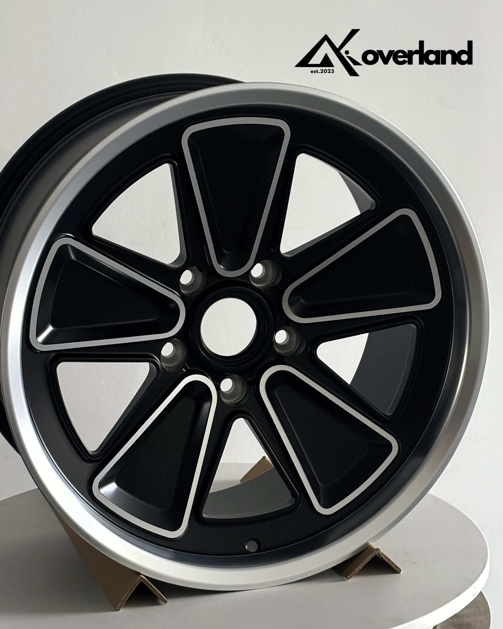 Studio shot of Porsche custom forged wheels in 5x130 bolt pattern, reimagined Fuchs design with precision CNC machining