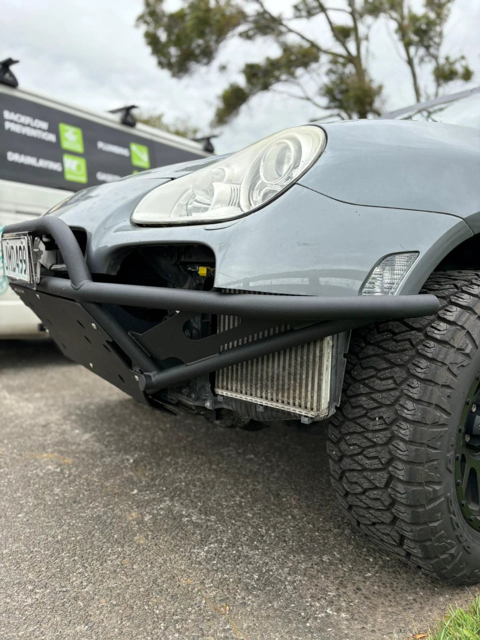 Porsche Cayenne 955 Turbo with Akioverland full height tubular bumper close up