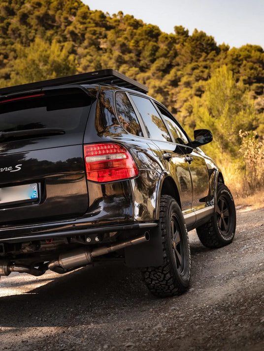 Custom Porsche Cayenne 957 build for luxury overland travel featuring forged Akioverland 5x130 Classic Porsche fuchs wheels