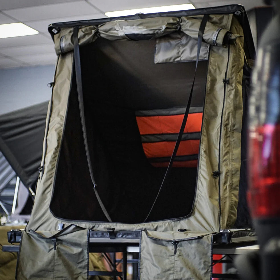 inspired overland lightweight overland rooftop tent installed on expedition Porsche Cayenne