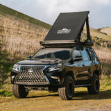 lightweight rooftop tent mounted on lexus gx 460 overland build in hilly terrain