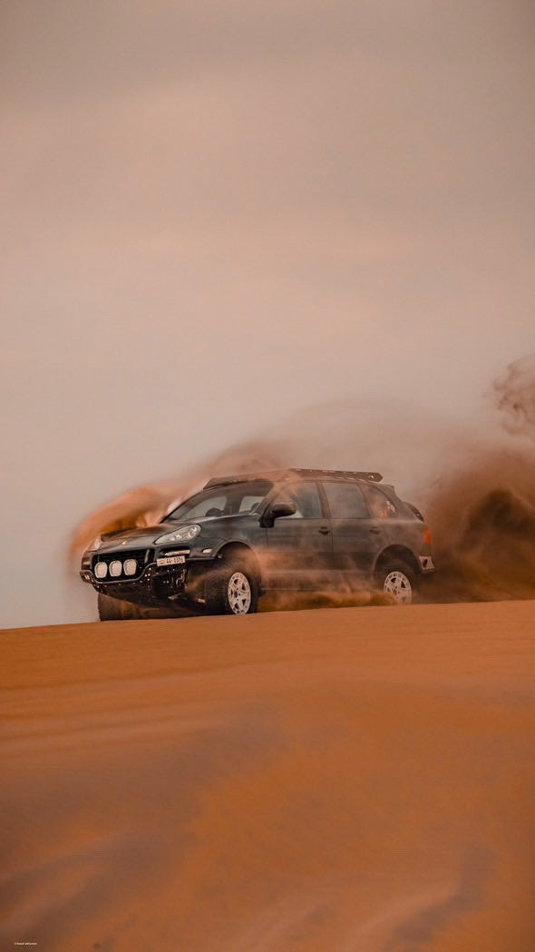 Lifted porsche Cayenne 957 GTS design edition with akioverland coilovers desert bashing kuwait desert 