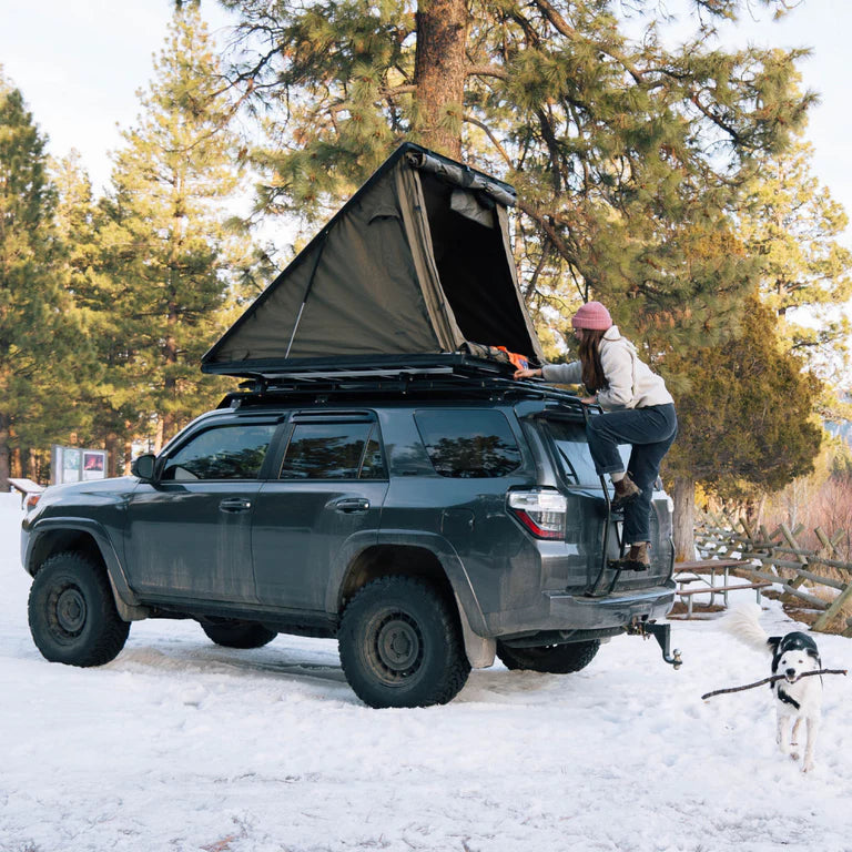 lightweight rooftop tent mounted on toyota 4runner overland build in snow forest