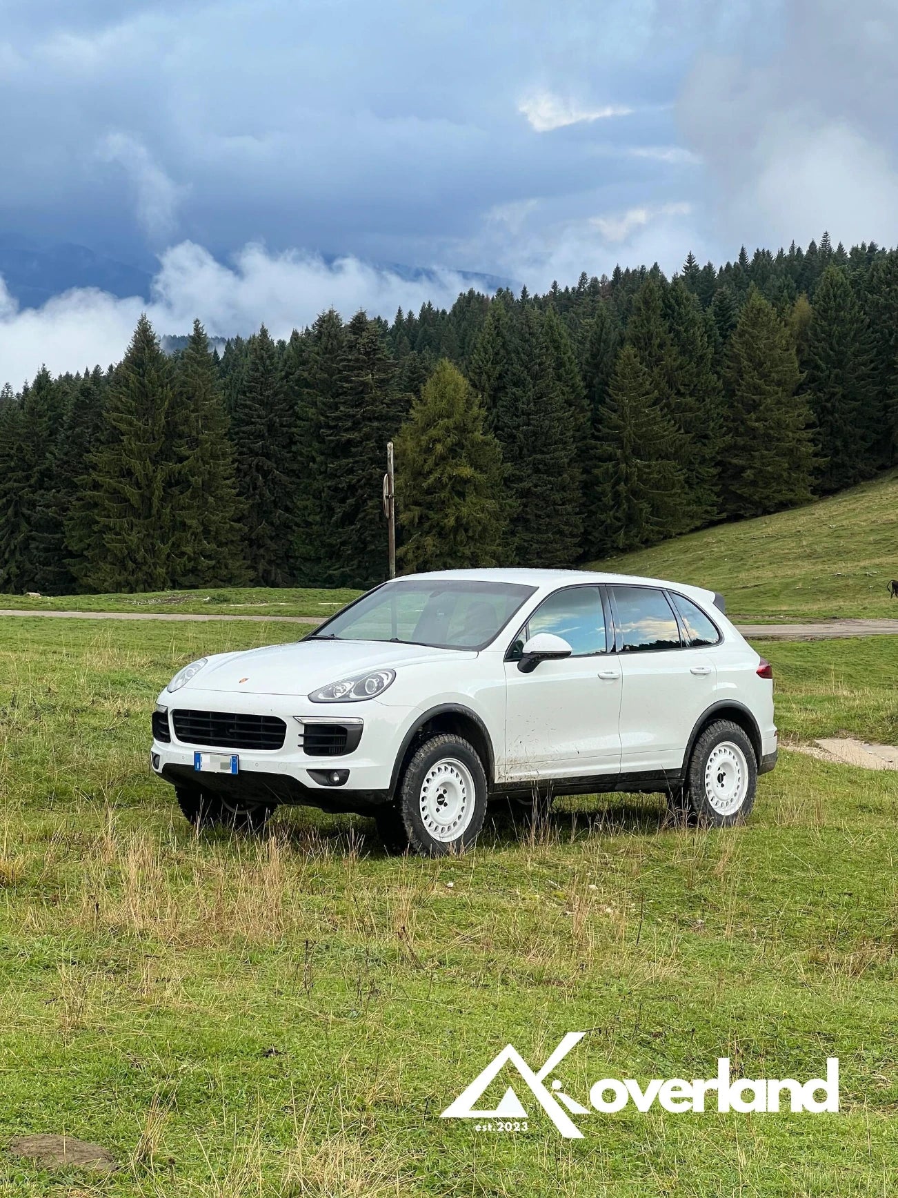 Porsche Cayenne 958 off-road build equipped with Akioverland spring lift kit and all-terrain tires, designed for overland driving and trail exploration