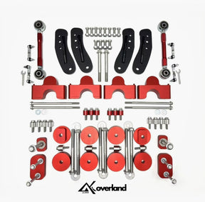 Akioverland V2 driveline drop kit for Porsche Cayenne 958 and VW Touareg 7P featuring engine, transmission, and cardan shaft lowering blocks with AKI-stamped 10.9 torque-rated hardware
