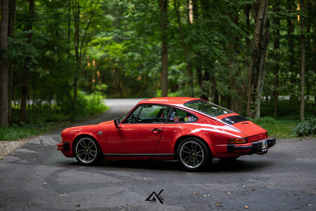 Classic Porsche 911 SC G Body rear three-quarter view with AkiOverland Fuchs Reimagined wheels