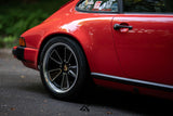 Close-up of 5x130 Fuchs Reimagined forged wheel on red Porsche 911 SC G Body