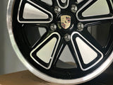 Close-up of Porsche custom forged wheel showing precision CNC-machined surface, reimagined Fuchs design in 5x130 fitment
