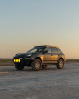Lifted Cayenne 957 GTS design edition with akioverland coilovers in kuwait desert during sunset