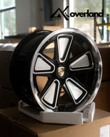 Custom Porsche forged wheels in 5x130 fitment, reinterpreting the classic Fuchs design with modern engineering