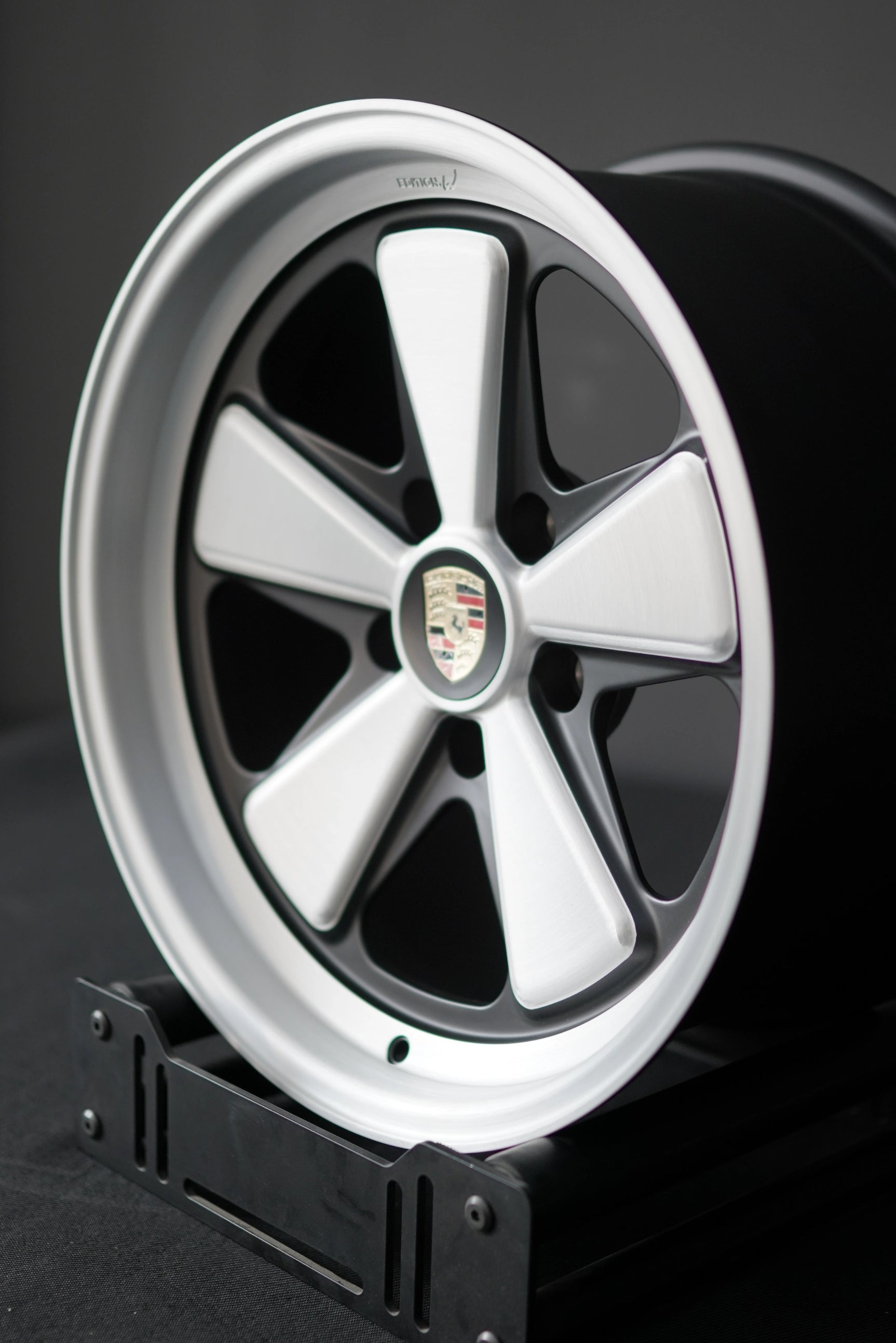 Three-quarter angle of Edition W forged wheel for Porsche 5x130 with classic five-spoke layout.