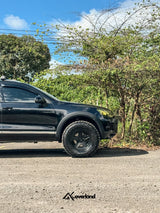 Akioverland-modified VW Touareg with widebody fenders and centering sleeve-equipped V3 subframe drop plus 2.5-inch coil spring lift for extreme terrain capability.