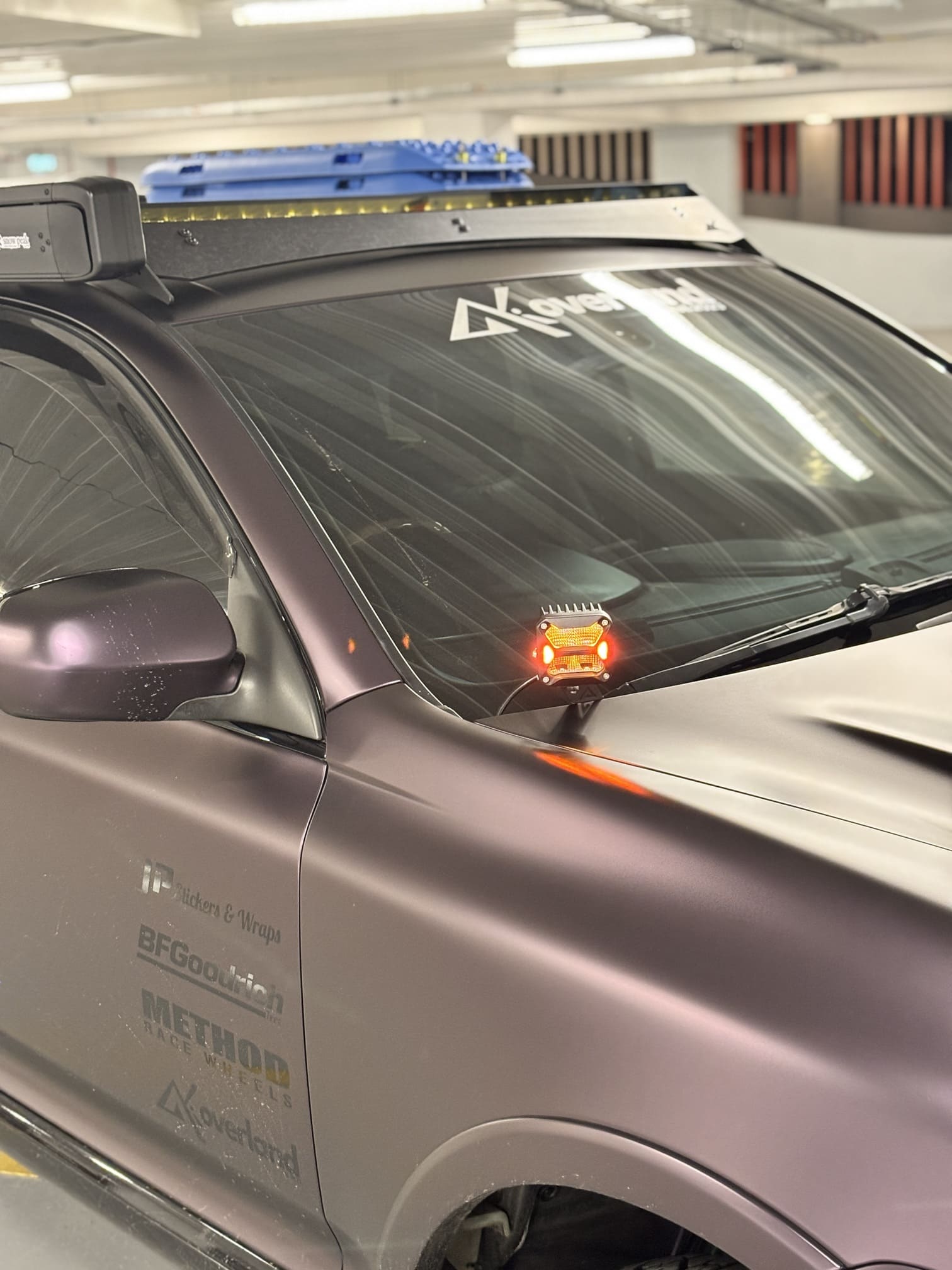 Matte purple Cayenne 957 Turbo offroad build by akioverland. Equipped with Novsight rock series led ditch lights