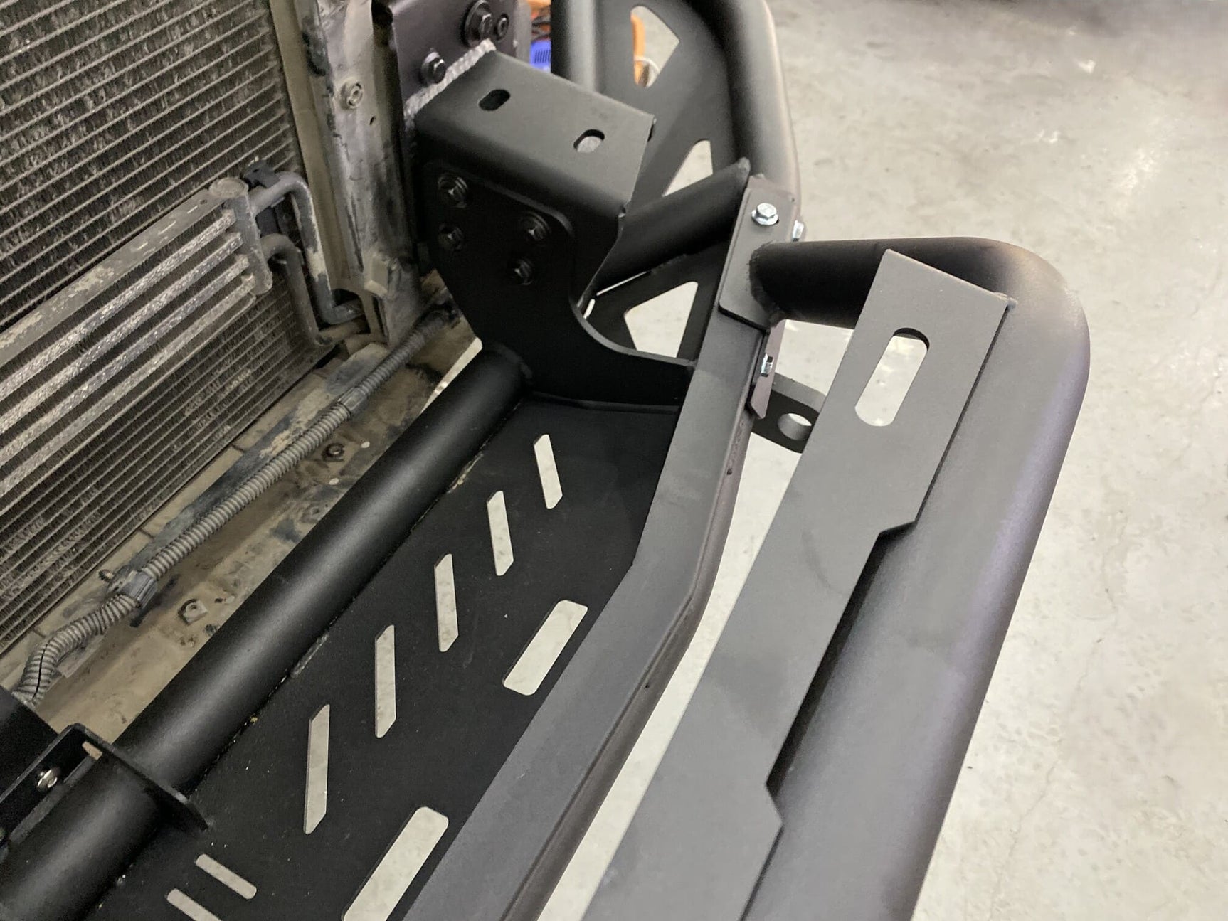 Close-up of heavy-duty Cayenne 955 off-road bumper with detachable bull bar