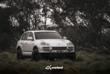 Porsche Cayenne 957 diesel off-road build by ISO100 featuring AkiOverland lift kit and steel tubular bumper, engineered by owners for owners
