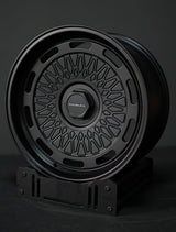 Akioverland 5x130 Aki Forged 04 Mesh wheel in black, displayed on stand-offroad and overland wheel choice for Porsche, VW & Audi