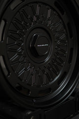 Studio shot of an Akioverland 5x130 Aki Forged 04 Mesh wheel in black, premium forged offroad wheel for Porsche