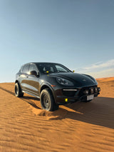 Lifted Porsche Cayenne 958 GTS fitted with Akioverland 5x130 Aki Forged 04 Mesh wheels, driving in the desert, Saudi Arabia