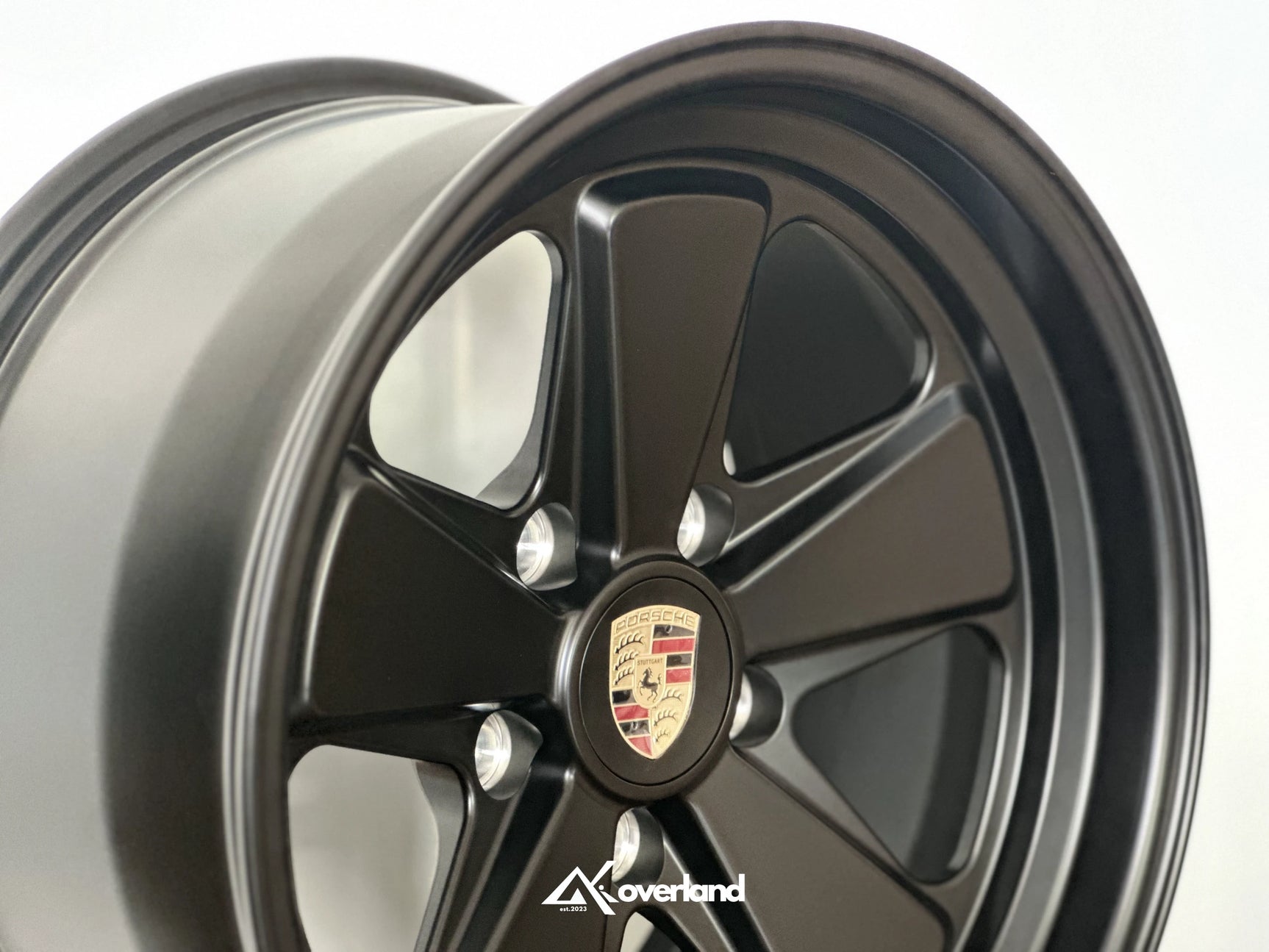 Satin black Akioverland 5x130 forged fuch wheel showing deep lip contour, engineered for Porsche Cayenne off-road use.