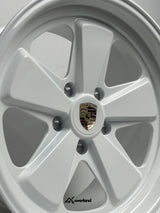 Gloss White Akioverland 5x130 forged wheel with Porsche crest, premium off-road fitment for Cayenne, Touareg, and Q7.