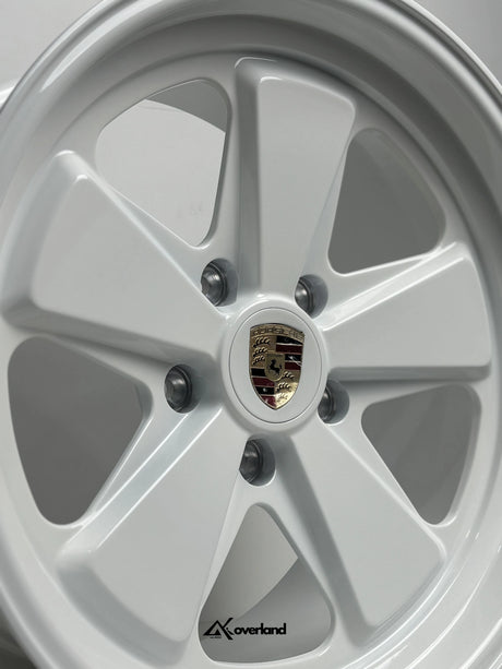 Gloss White Akioverland 5x130 forged wheel with Porsche crest, premium off-road fitment for Cayenne, Touareg, and Q7.