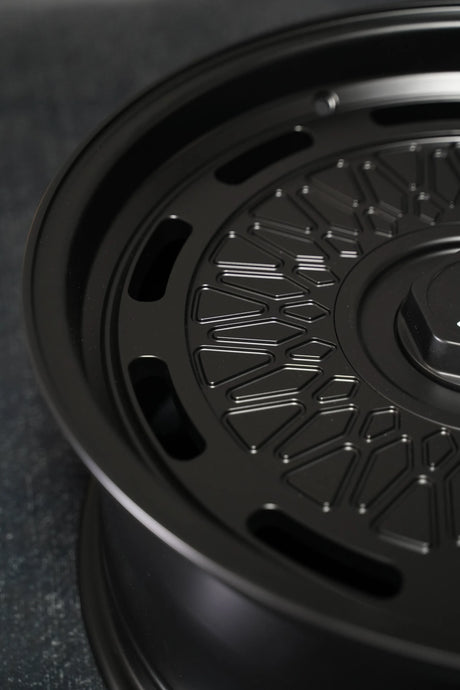 Close-up of the Aki Forged 04 Mesh 5x130 forged wheel in black showing mesh spoke and lip detail, Akioverland