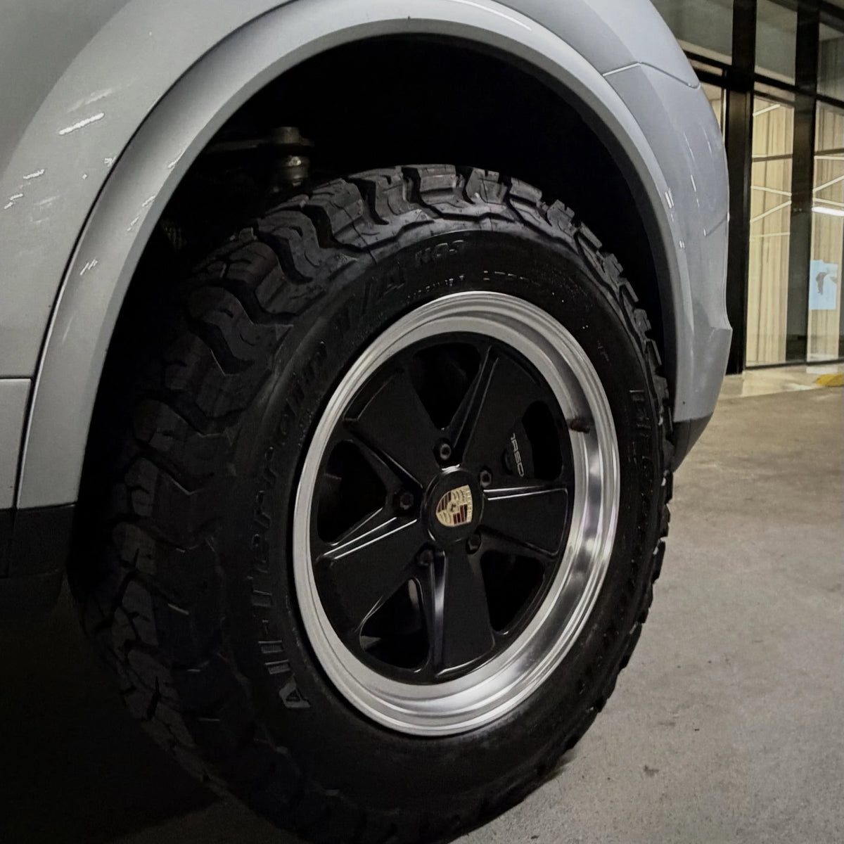 2 Tone Classic Fuchs forged wheels by AkiOverland fitted to a silver lifted Porsche Cayenne 958