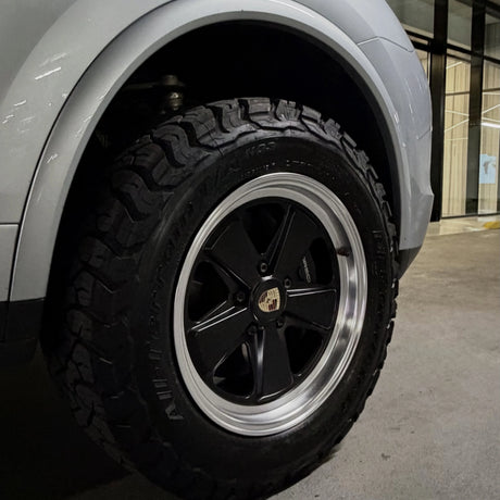 2 Tone Classic Fuchs forged wheels by AkiOverland fitted to a silver lifted Porsche Cayenne 958