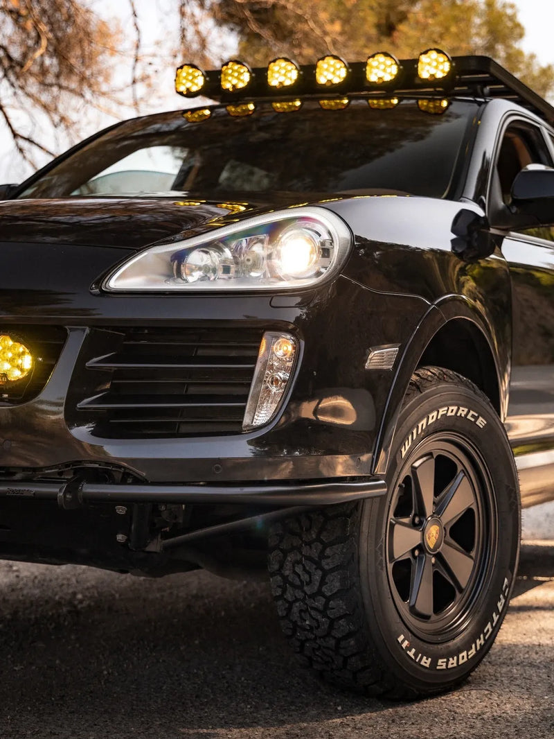 Bespoke Porsche Cayenne overland SUV with 265/65R18 tires and Akioverland Classic Fuchs style forged wheel
