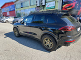 Right side profile of a Porsche Cayenne 958 running AkiOverland 5x130 Cookie Cutter Rugged wheels in Bronze Neon with a hint of green