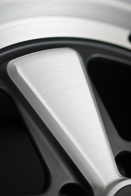 Three-quarter studio view of the AkiOverland Edition W forged wheel for Porsche 5x130 with classic five-spoke layout