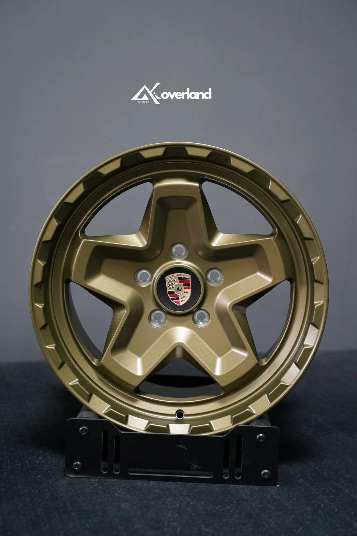 Akioverland 5x130 Forged Cookie Cutter Rugged wheel in special Bronze with Hidden Green finish, face-on view of the wheel face and center cap