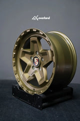 Akioverland 5x130 Forged Cookie Cutter Rugged wheel in special Bronze with Hidden Green finish, three-quarter view showing face and barrel