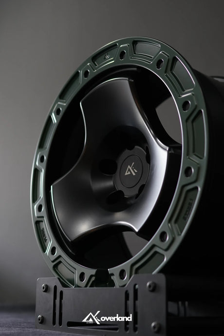 Akioverland Peaks 5x120 forged trispoke wheel in studio setting for range rovers