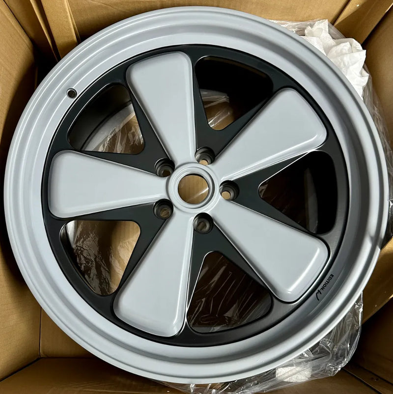 AkiOverland x WrapWorkz Edition W Forged Fuchs wheel unboxing — crayon grey over satin black two-tone forged Porsche Fuchs wheel fresh from shipping box, Macan fitment