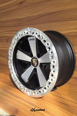 Forged monoblock beadlock wheel for Porsche Cayenne and VW Touareg, showcasing deep dish profile and precision machining.