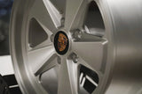 Close-up of a Satin Brushed silver 5x130 Custom Classic fuch wheel for porsche 